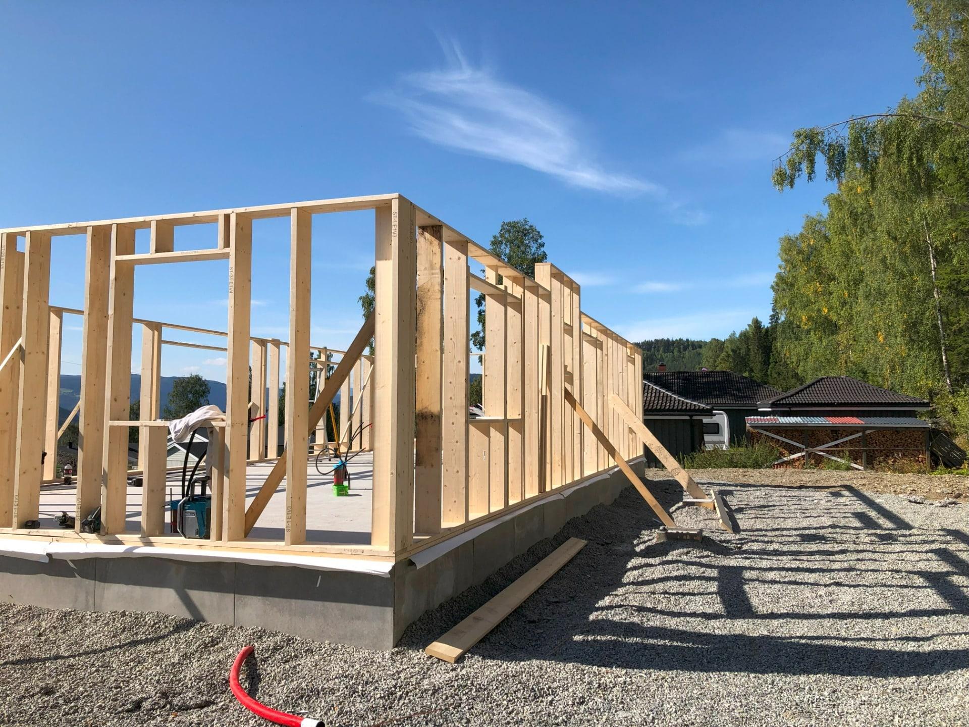 New timber wall frames standing on a fresh concrete slab